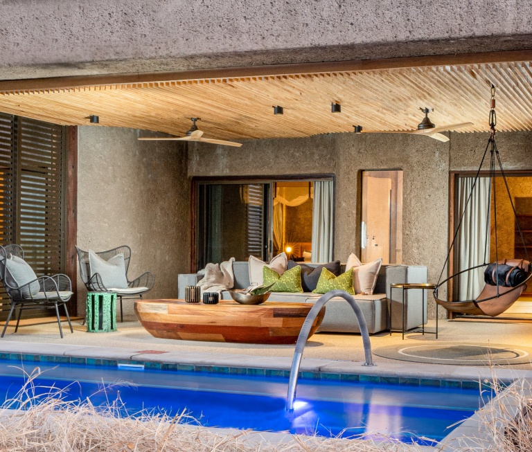 Witness the architectural masterpiece of Sabi Sabi Earth Lodge's luxury suite exterior, blending design and nature. Witness the architectural masterpiece of Sabi Sabi Earth Lodge's luxury suite exterior, blending design and nature.